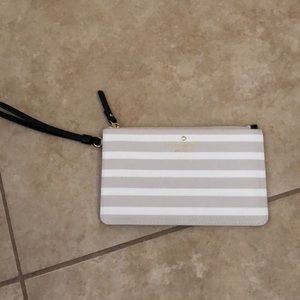 Kate Spade white and cream striped wristlet